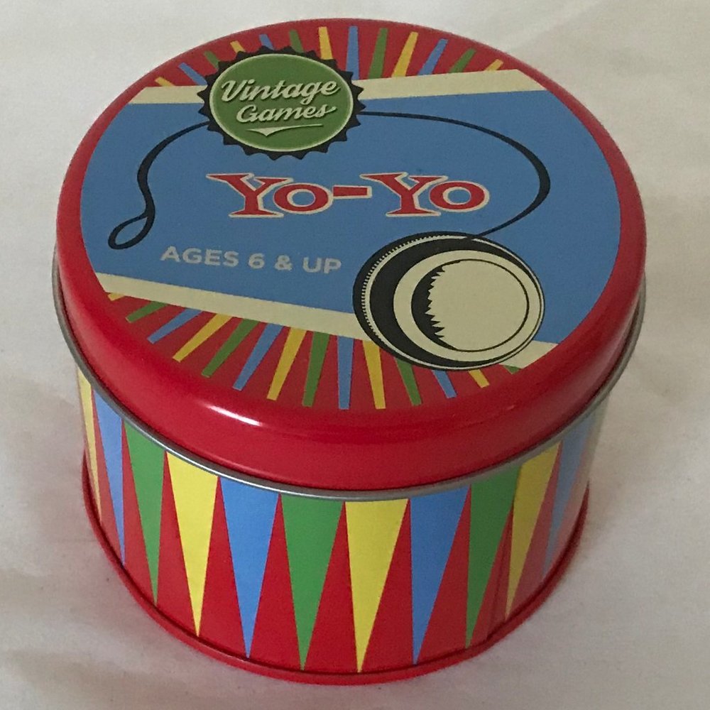 Yoyo in colorful round, lidded tin NWOT
